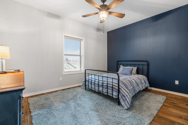 bedroom featuring dark wood-type flooring and ceiling fan