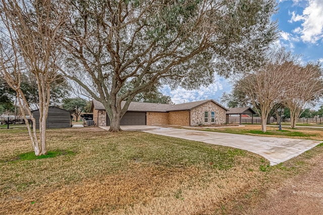 ranch-style home with a garage and a front yard