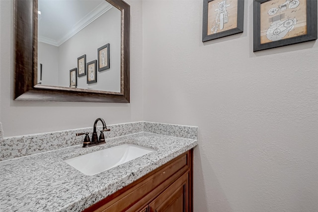 bathroom with vanity and crown molding