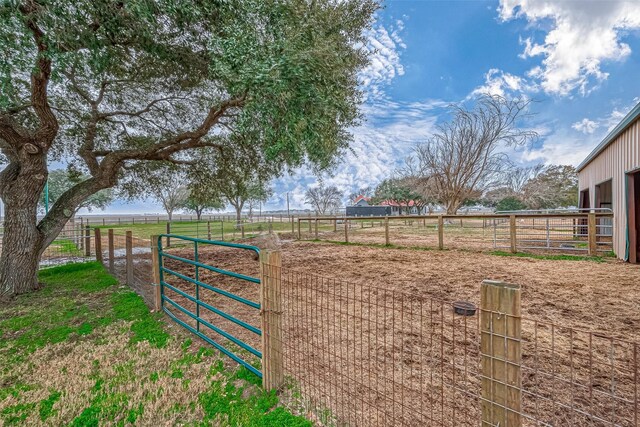 view of yard with a rural view