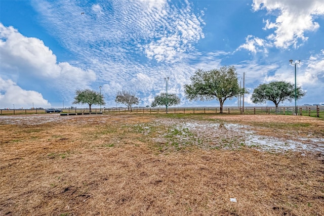 view of yard with a rural view