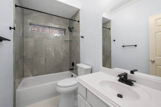 full bathroom featuring vanity, ornamental molding, toilet, and tiled shower / bath