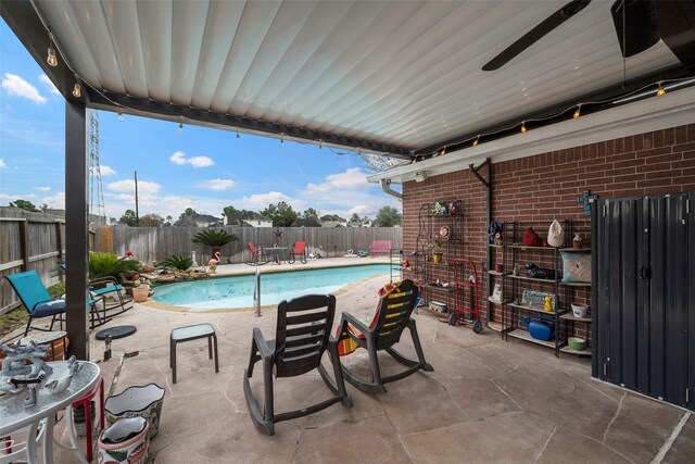 view of swimming pool with a patio