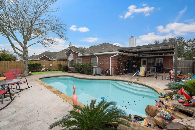 view of pool featuring a patio and central AC unit