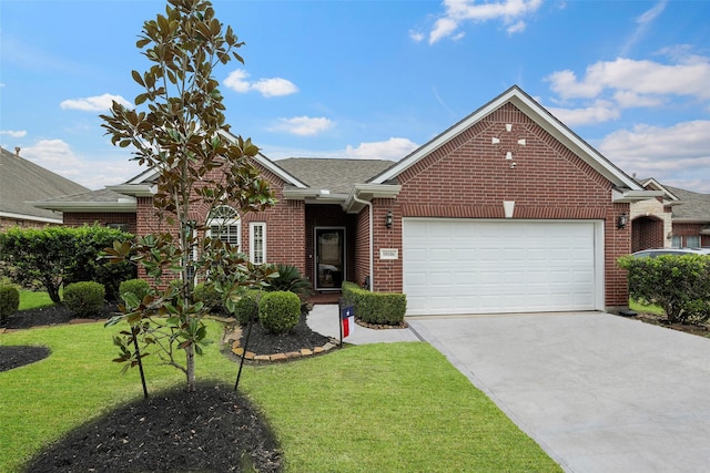 view of front of property with a garage and a front lawn