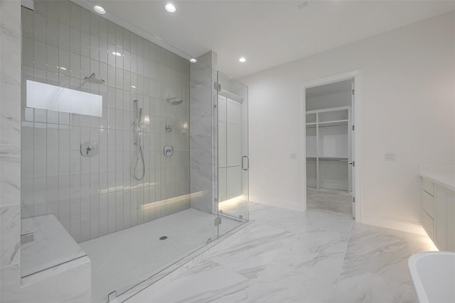 bathroom featuring shower with separate bathtub