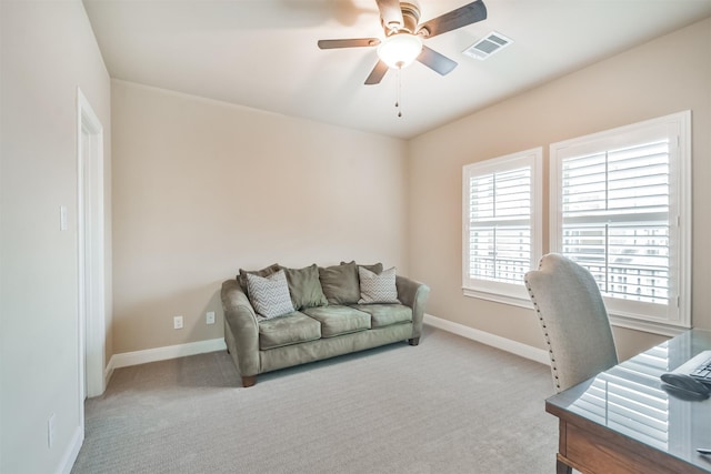 office with light carpet and ceiling fan