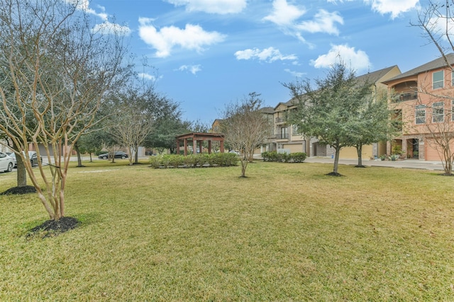 view of home's community featuring a lawn