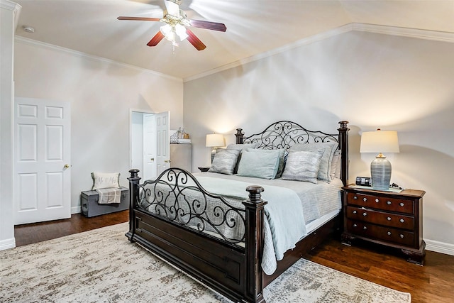 bedroom featuring dark wood-type flooring, ceiling fan, ornamental molding, and vaulted ceiling