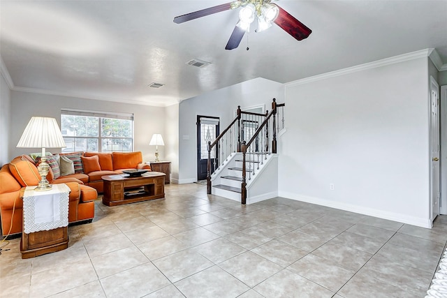 tiled living room with ornamental molding and ceiling fan