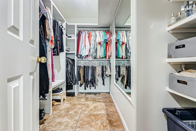 walk in closet featuring light tile patterned floors