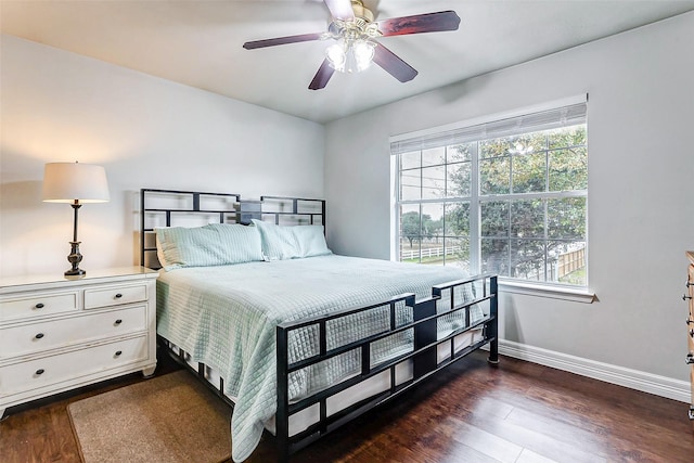 bedroom featuring ceiling fan and dark hardwood / wood-style flooring