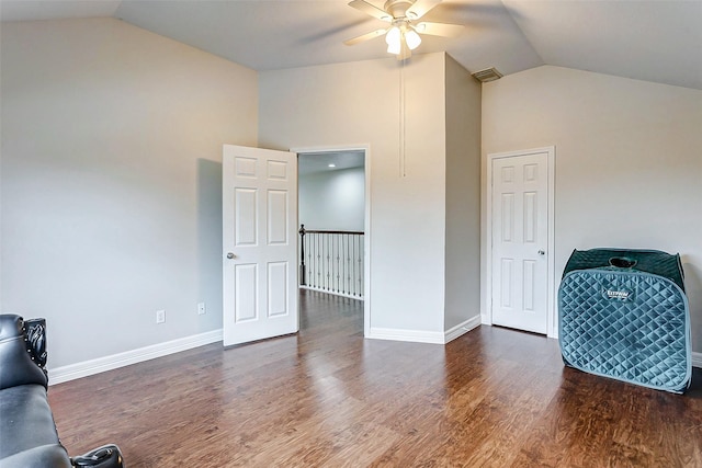 living area featuring high vaulted ceiling, dark wood-type flooring, and ceiling fan