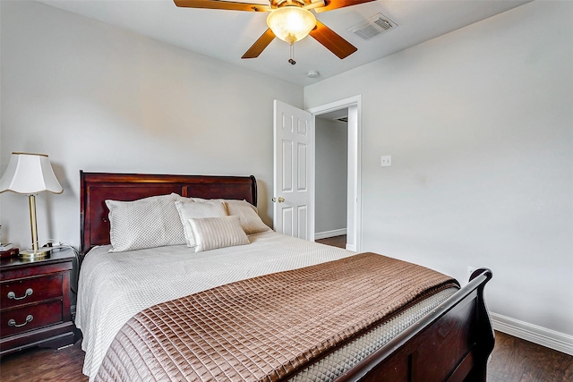 bedroom with dark hardwood / wood-style floors and ceiling fan