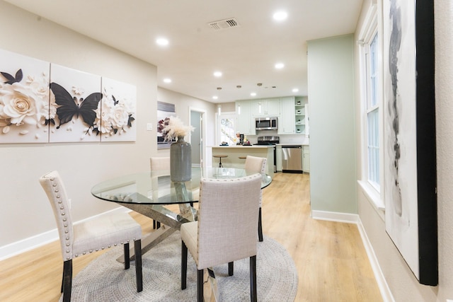 dining room featuring light wood-type flooring