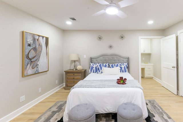 bedroom with ceiling fan and light hardwood / wood-style flooring