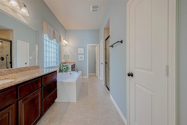 bathroom featuring vanity, separate shower and tub, and tile patterned floors