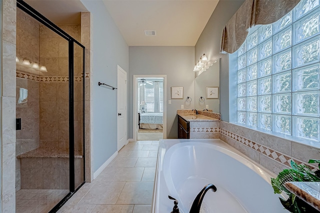 bathroom with vanity, shower with separate bathtub, a wealth of natural light, and ceiling fan