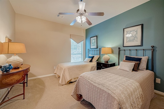 bedroom featuring light carpet and ceiling fan