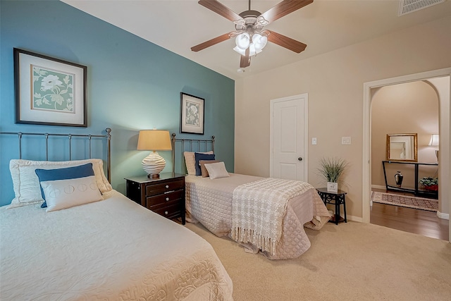 carpeted bedroom with ceiling fan