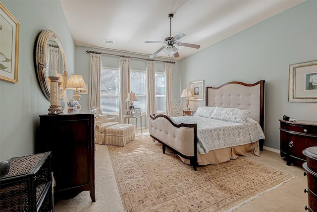 bedroom featuring ceiling fan, carpet flooring, and vaulted ceiling