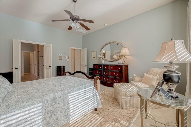 bedroom with lofted ceiling and ceiling fan