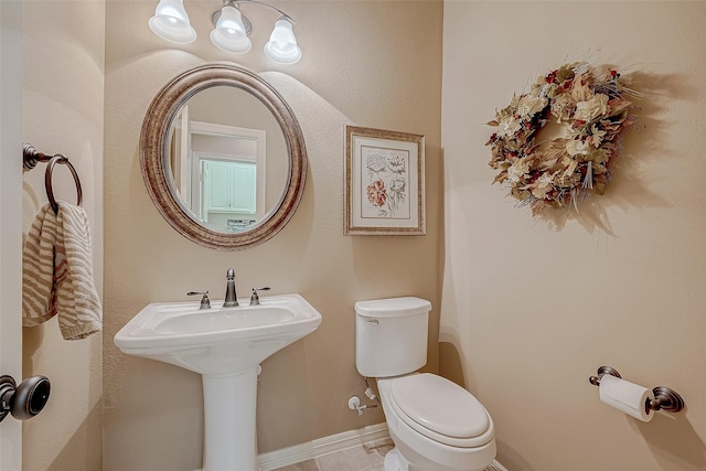 bathroom with toilet and sink