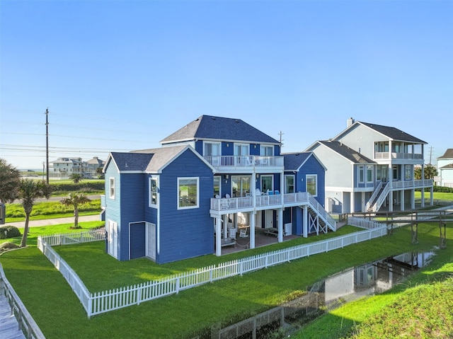 back of property featuring a balcony