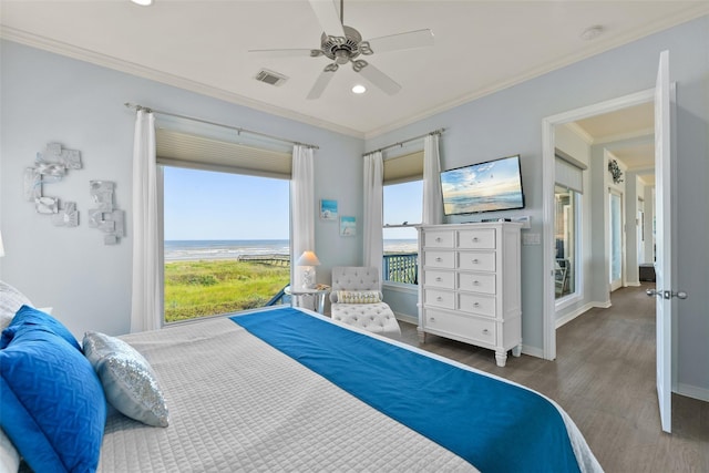 bedroom featuring ceiling fan, ornamental molding, and dark hardwood / wood-style flooring