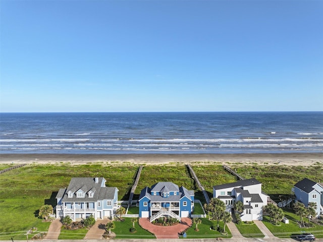 bird's eye view with a view of the beach and a water view