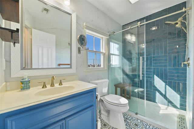 bathroom with walk in shower, vanity, and toilet