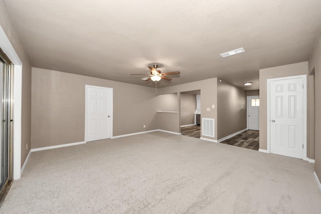 carpeted empty room with ceiling fan