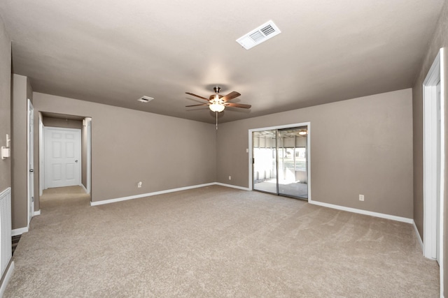 carpeted empty room featuring ceiling fan