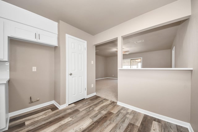 interior space featuring hardwood / wood-style flooring and ceiling fan