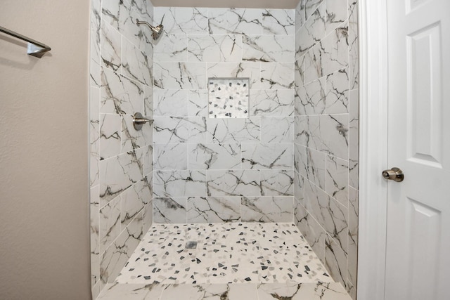 bathroom featuring a tile shower