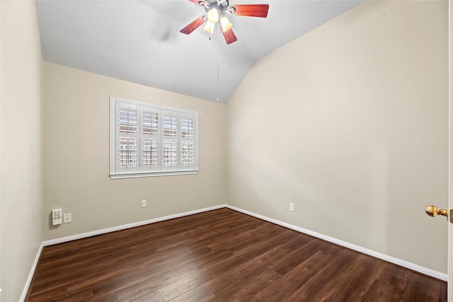 unfurnished room with ceiling fan, dark hardwood / wood-style floors, and vaulted ceiling