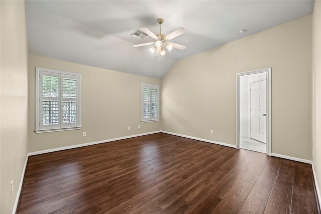 unfurnished room featuring dark wood-type flooring, ceiling fan, lofted ceiling, and a wealth of natural light