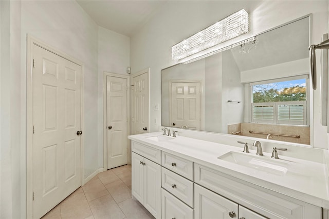 bathroom featuring tile patterned flooring and vanity