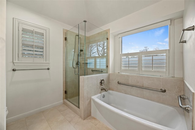 bathroom with tile patterned floors and independent shower and bath