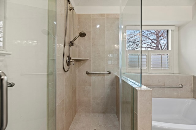 bathroom featuring separate shower and tub