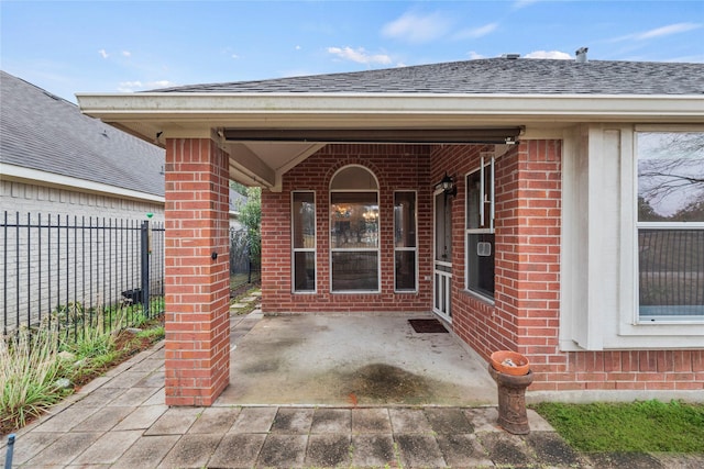 entrance to property with a patio area