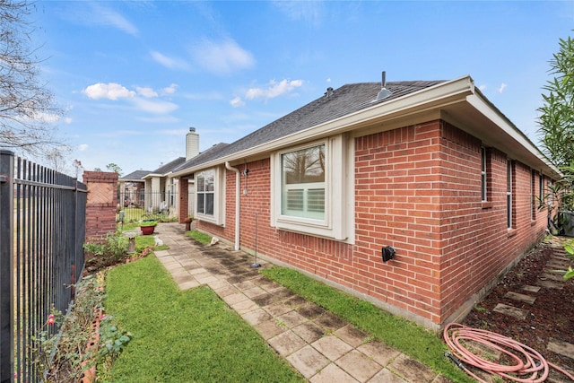 view of home's exterior featuring a yard