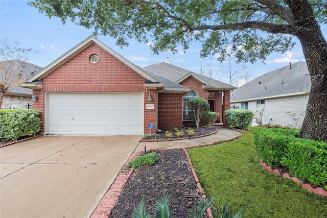 view of front of home with a garage and a front lawn