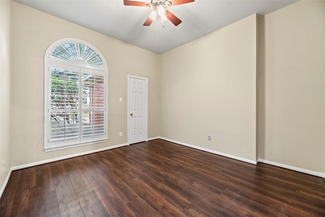 unfurnished room with ceiling fan and dark hardwood / wood-style flooring