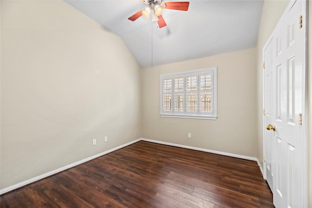 unfurnished room with vaulted ceiling, dark hardwood / wood-style floors, and ceiling fan