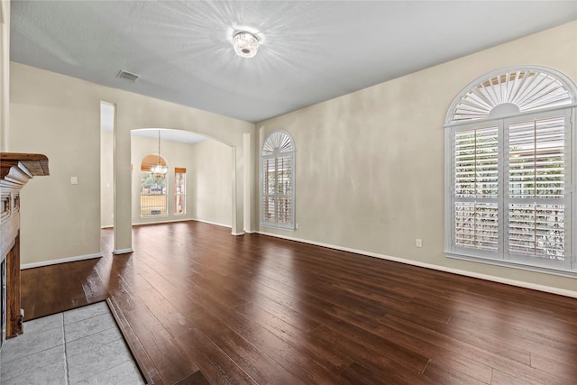 unfurnished living room with wood-type flooring