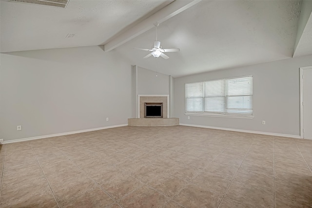 unfurnished living room with vaulted ceiling with beams, a fireplace, ceiling fan, and light tile patterned flooring