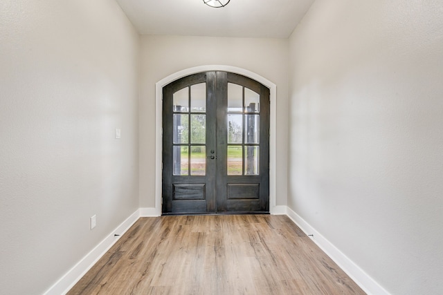 doorway to outside featuring light wood-type flooring and french doors