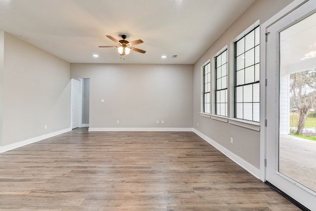 unfurnished room with light hardwood / wood-style flooring and ceiling fan