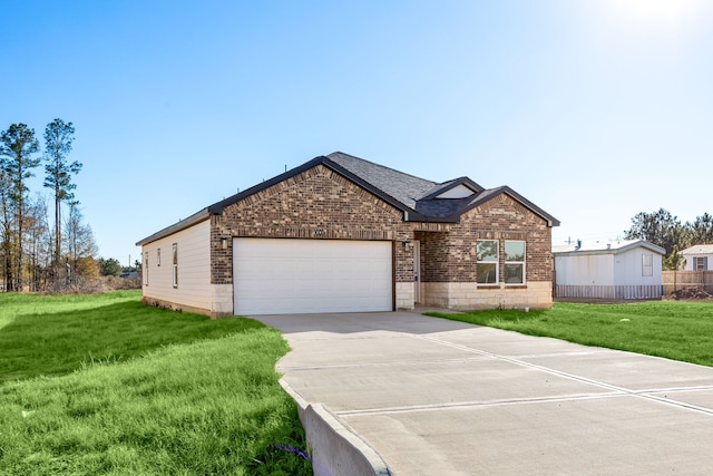 view of front facade featuring a garage and a front lawn